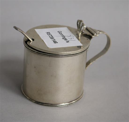 A George V silver drum mustard, Birmingham, 1910 and a silver mustard spoon.
